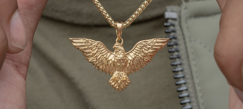alt=" model wearing the eagle gold pendant"