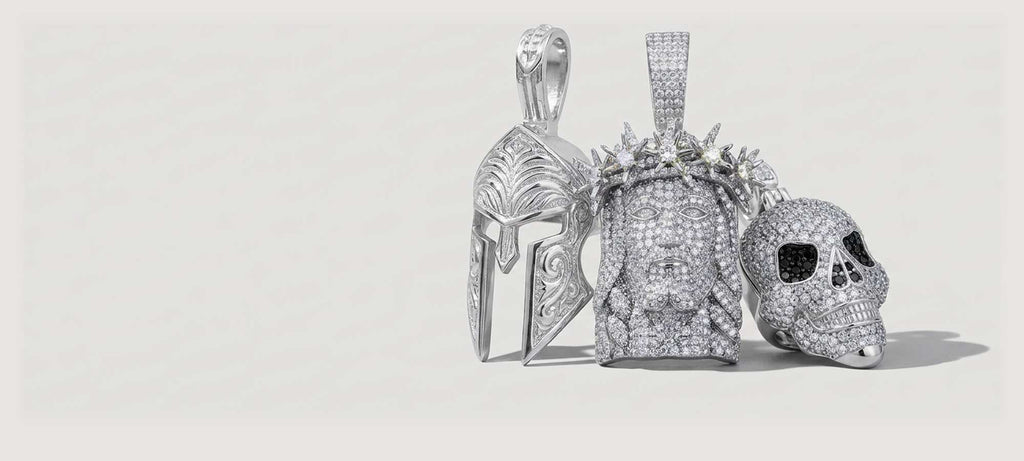 A detailed silver lion head pendant with a realistic mane, displayed against a plain light gray background. The pendant is centered left and features a shiny, polished finish.