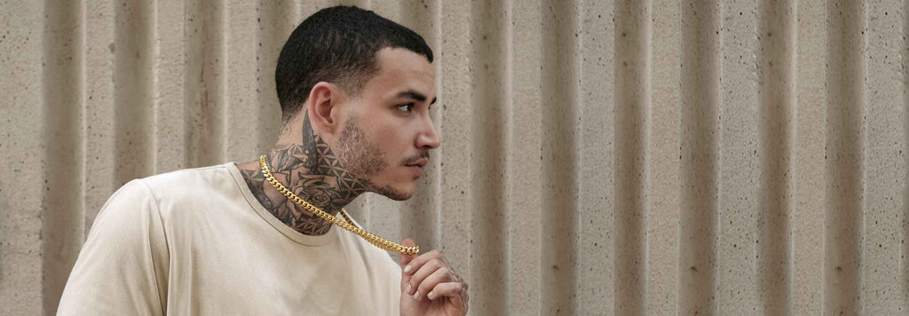 alt="a model wearing our handmade Cuban link chains"