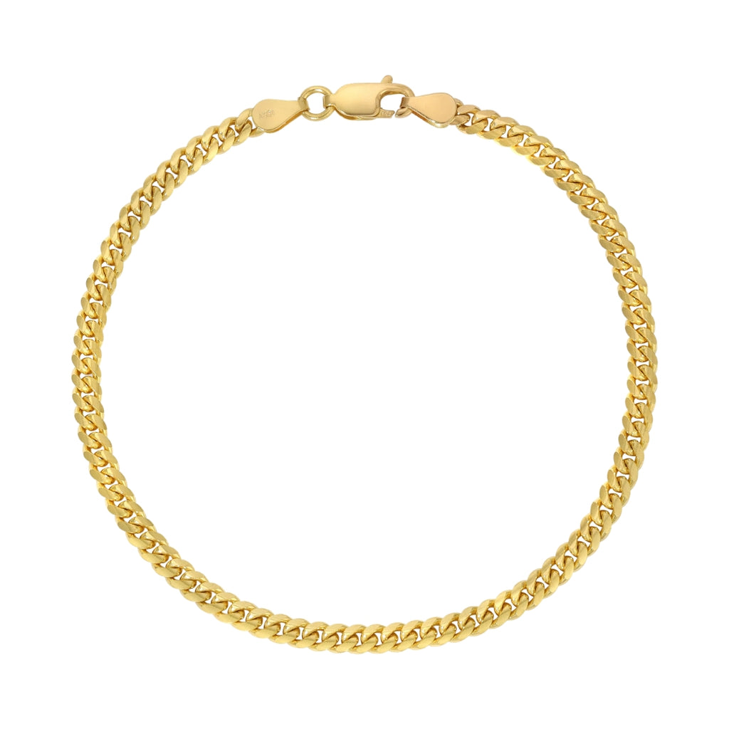 The Cuban Link Bracelet - 3mm features a secure clasp and classic gold design, adding timeless elegance to any look.
