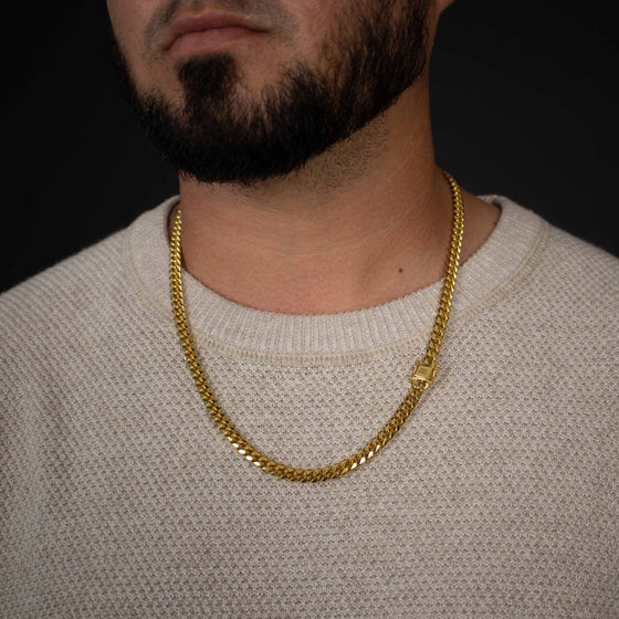 6mm - Cuban Link Chain - 14k Gold Bonded| GOLDZENN- Chain and lock view while a model wearing it.