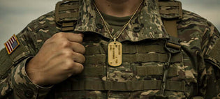  ALT="The Symbolism of Dog Tag Pendants: Strength, Identity, and Individuality Dog tags have come a long way from their military origins. Once used to identify soldiers, military dog tags have evolved into bold fashion statements, symbolizing strength, ide