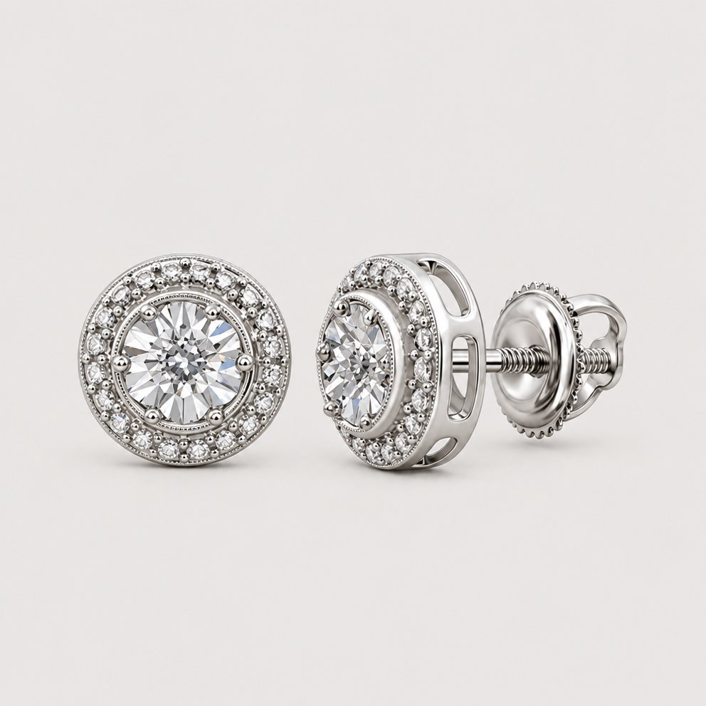 A pair of 0.01CTW Diamond Round Earrings in sterling silver is shown on a reflective circular surface against a warm off-white studio background.