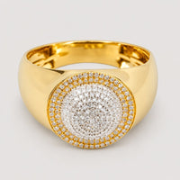 The 0.49 CTW Cluster Round Natural Diamond Ring in 14K yellow gold features a wide band and a large round centerpiece set with multiple sparkling natural diamonds arranged in concentric circles.