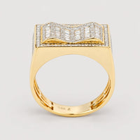 The 0.73 CTW Natural Diamond Cluster Ring in 14K yellow gold for men features a wide, rectangular top adorned with rows of natural diamonds, forming a striking wavy, three-dimensional cluster pattern.