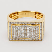 The 0.73 CTW Natural Diamond Cluster Ring in 14K yellow gold features a rectangular top with natural baguette and round diamonds in a wavy cluster, bordered by a pavé of smaller natural diamonds.