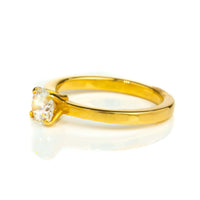 The 0.73ct Round Lab Diamond Solitaire Engagement Ring in 14k gold features a single round lab diamond in classic prongs—an elegant women's engagement ring set against a white background.