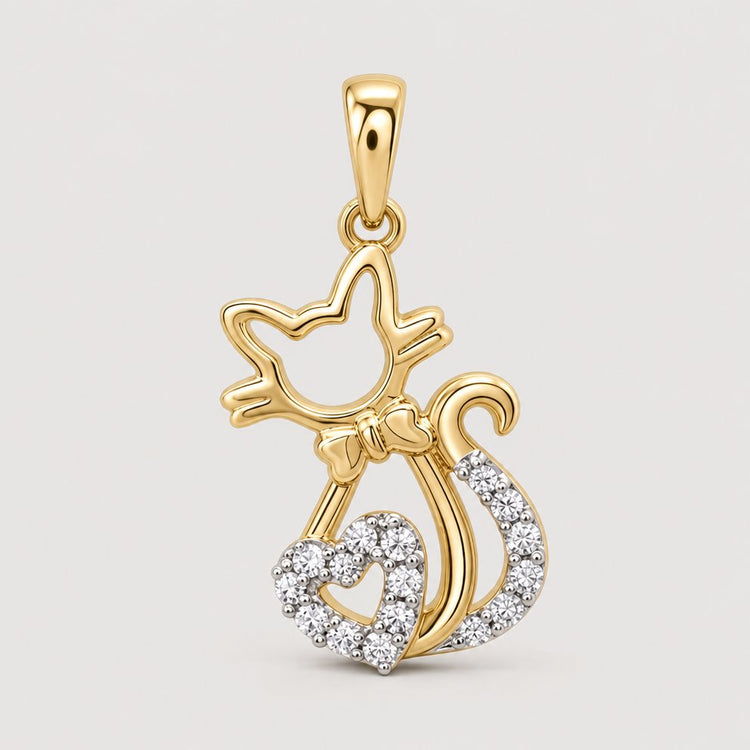 Delicate and elegant, the 1/10 CTW Diamond Heart Cat Pendant in 10K Gold features a heart-shaped tail accented with diamonds—a perfect piece of cat lover jewelry shown on a plain warm off-white studio background.