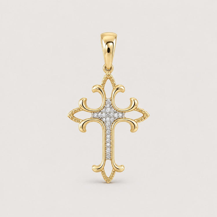 1/12CTW Diamond Fashion Cross Pendant in 10K gold features curved ornate edges and a center lined with sparkling diamonds—a sophisticated fashion jewelry piece displayed on a warm off-white studio background.