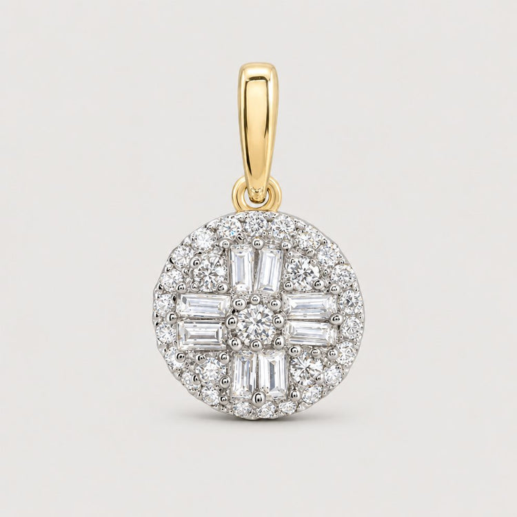 The 1/3 Cttw Diamond Round Baguette Pendant in 10K gold features a cluster of sparkling natural diamonds in round and baguette cuts, with a gold bail, shown against a warm off-white studio background.