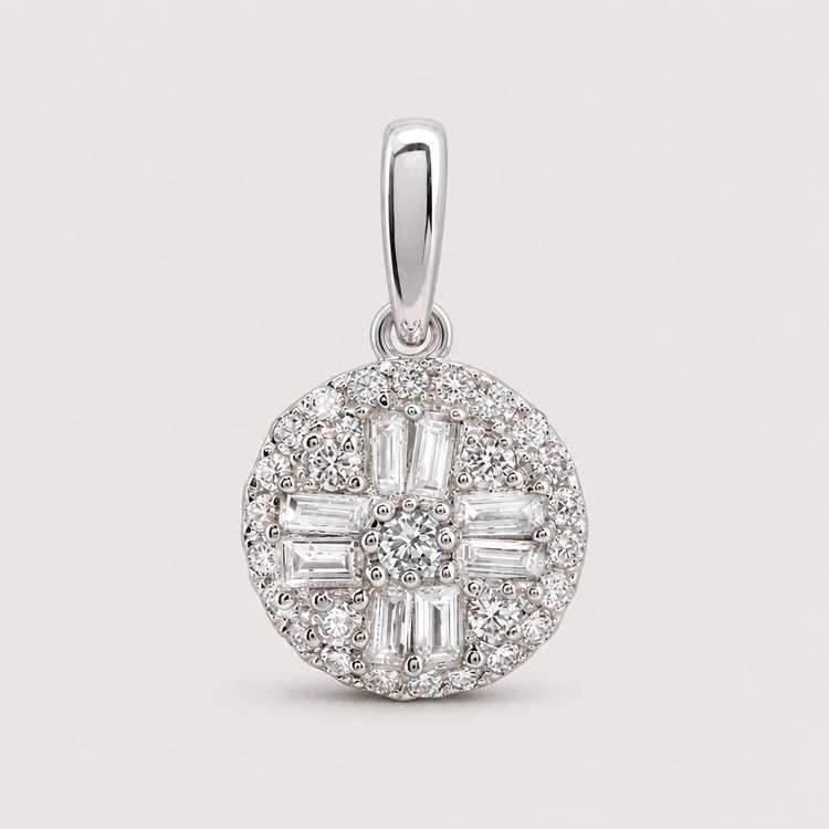 The 1/3 Cttw Diamond Round Baguette Pendant in 10K Gold features a cluster of sparkling baguette and round diamonds in a geometric pattern with a polished bail, displayed against a warm off-white studio background.