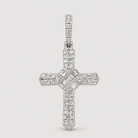 The 1/4 CT Natural Diamond Cross Pendant in 10K gold features sparkling round and baguette-cut diamonds in elegant rows, displayed on a marble-like background—ideal for anyone who values meaningful spiritual jewelry.