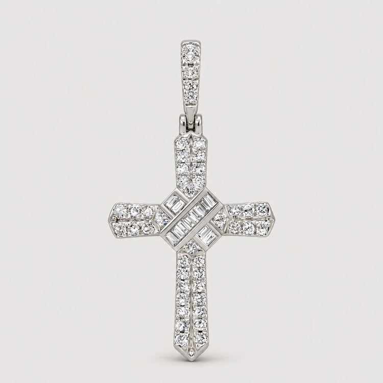 The 1/4 CT Natural Diamond Cross Pendant in 10K gold features sparkling round and baguette-cut diamonds in elegant rows, displayed on a marble-like background—ideal for anyone who values meaningful spiritual jewelry.