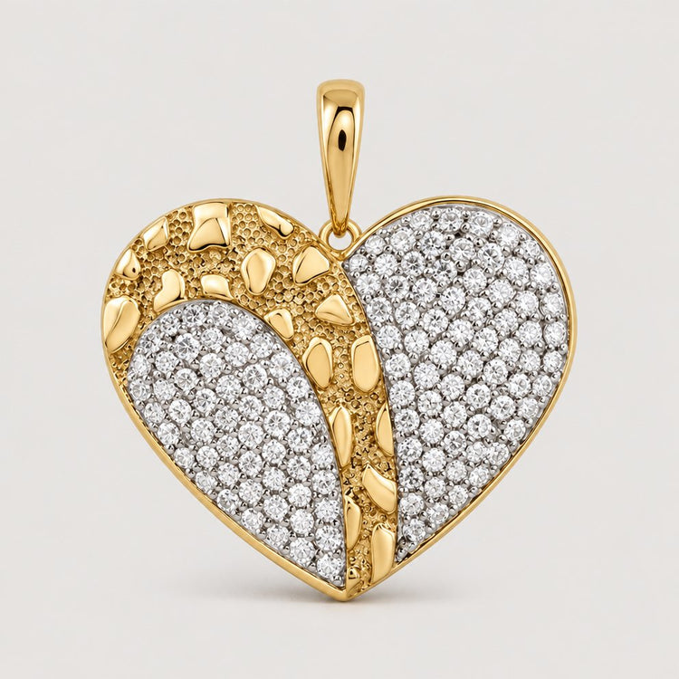 The 1 CTW Diamond Heart Pendant in Yellow Gold features a heart design with one textured gold half and one accented by sparkling diamonds, finished with a gold bail for elegant wear on any chain.