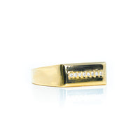 The Signet with Line of Gemstones Ring in 10k Gold features a rectangular top with a horizontal row of sparkling stones set against black, elegantly displayed on a white background.
