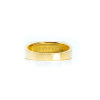 A close-up of the Signet with Line of Gemstones Ring in 10k gold, featuring a rectangular outer shape, smooth finish, and an engraved "JACQUEMUS" inscription inside the band.