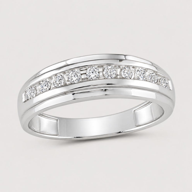 The 10k Two-Tone Gold Diamond Wedding Band – 1/4 Cttw features a polished band with sparkling diamonds set in a channel across the top—a stunning wedding band for any occasion.