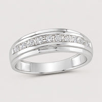 The 10k Two-Tone Gold Diamond Wedding Band – 1/4 Cttw features a polished band with sparkling diamonds set in a channel across the top—a stunning wedding band for any occasion.