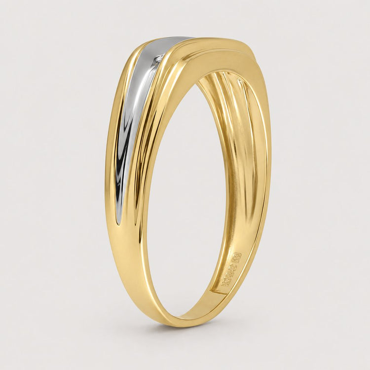 The 10k Two-Tone Gold Diamond Wedding Band – 1/8 Cttw features a modern design with a sleek silver accent atop two-tone gold, beautifully set against a plain warm off-white studio background.