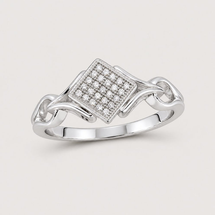 The 10k White Gold Diamond Offset Square Ring 1/12 Cttw features a square diamond cluster on a split shank band with geometric openwork sides.
