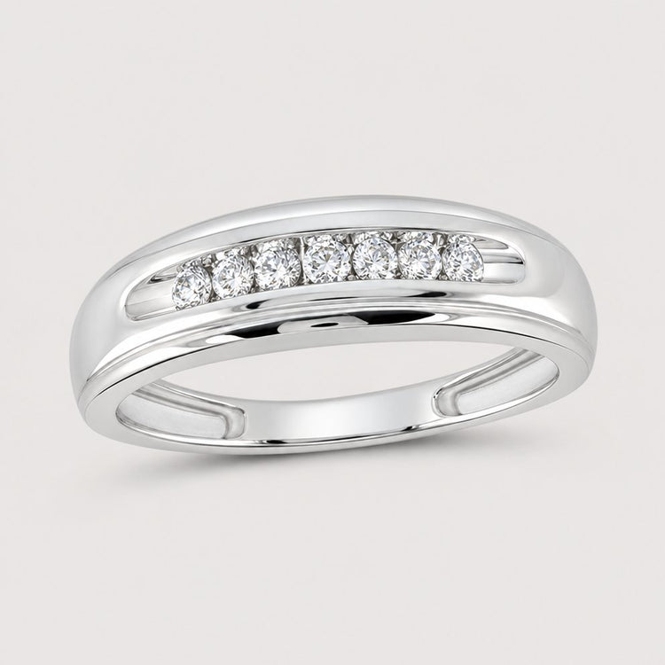 The 10k White Gold Round Diamond Wedding Band 1/4 Cttw features seven round diamonds in a horizontal channel, offering a polished look and timeless elegance suitable for any wearer.