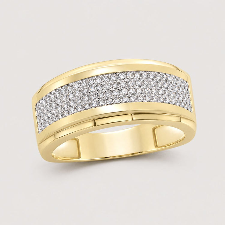 The 10K Yellow Gold Diamond Band Ring 1/3 Cttw features a central strip of sparkling diamonds set against polished gold for a striking, elegant look.