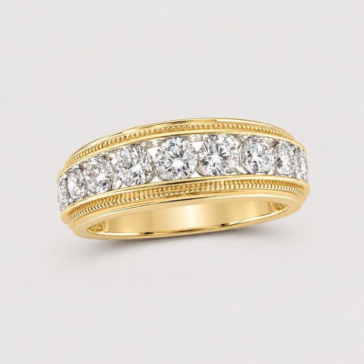 The 10k Gold Round Diamond Band Ring 2 CTTW features a row of sparkling round diamonds across the center and detailed edging on both sides, showcased against a warm off-white studio background.