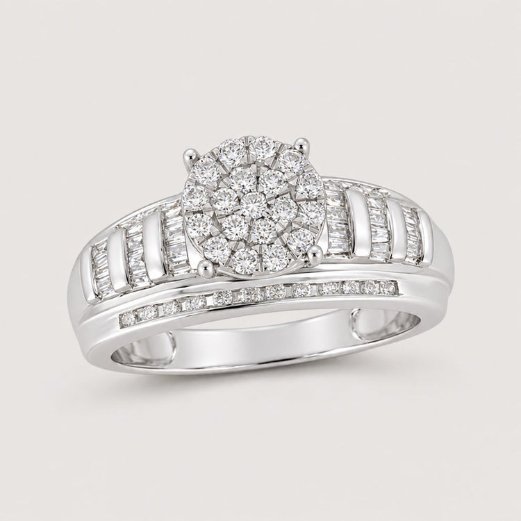 The 10k Gold Round Diamond Cluster Bridal Ring 1/2 Cttw features a stunning diamond cluster center with baguette and round diamonds set into an elegant split shank band—perfect for engagements.