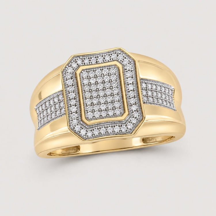 The 10k Yellow Gold Diamond Cluster Ring 1/3 Cttw features a wide band and a rectangular diamond-encrusted center with sparkling accents—a gorgeous cluster ring for any occasion.