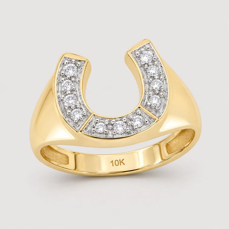 The 10k Gold Diamond Horseshoe Ring 1/20 Cttw, crafted in 10K yellow gold and accented with diamonds, is shown against a warm off-white studio background.