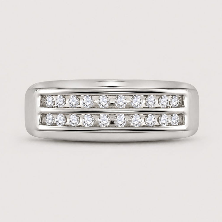 The 10k Gold 2-Row Diamond Wedding Band – 1/4 Cttw features two parallel rows of channel-set diamonds for a sleek, modern look, shown against a plain warm off-white studio background.