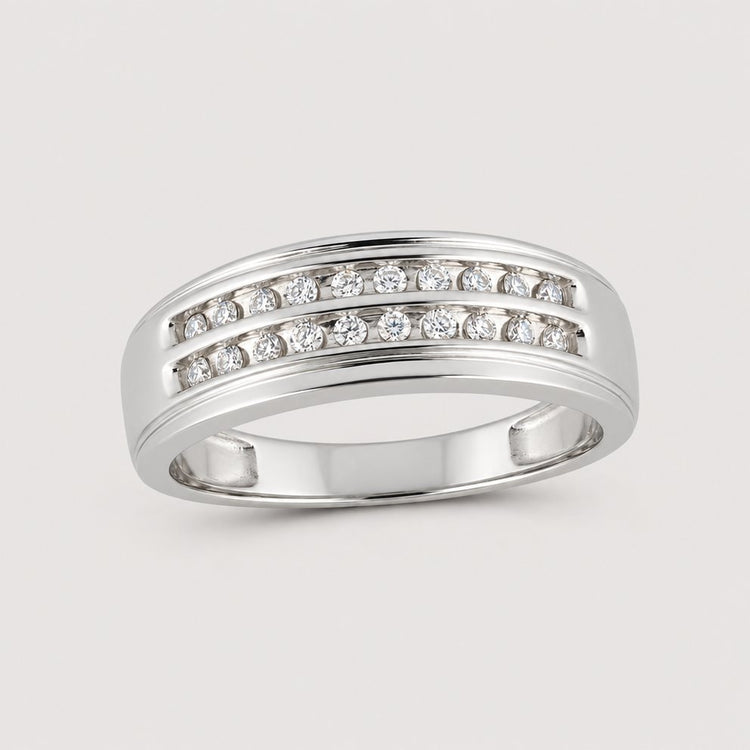 A sleek and modern 10k Gold 2-Row Diamond Wedding Band – 1/4 Cttw gleams against a plain warm off-white studio background, featuring two horizontal rows of channel-set diamonds.