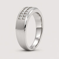 The 10k Gold 2-Row Diamond Wedding Band – 1/4 Cttw features channel-set diamonds in two rows, a matte finish, and a sleek modern look with a polished edge on one side.
