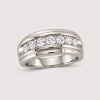 The 10k Gold Diamond Channel-Set Wedding Band Ring showcases seven round-cut diamonds totaling 1 carat, set in a wide, polished band of gold.