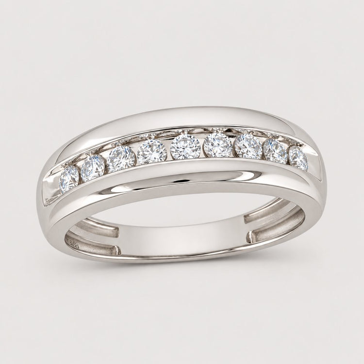 The 10k Gold Round Diamond Wedding Band 1/2 Cttw showcases seven round-cut diamonds in a channel setting with a polished split shank, offering a sophisticated and elegant choice for a wedding band—displayed on a warm off-white studio background.