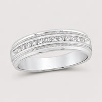 The 10k Gold Round Diamond Wedding Band 1/4 Cttw features a single row of round diamonds at the center, accented by elegant milgrain detailing along the edges.