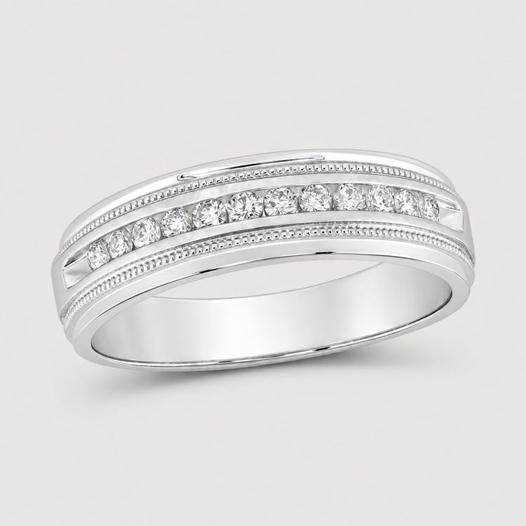 The 10k Gold Round Diamond Wedding Band 1/4 Cttw features a single row of round diamonds at the center, accented by elegant milgrain detailing along the edges.