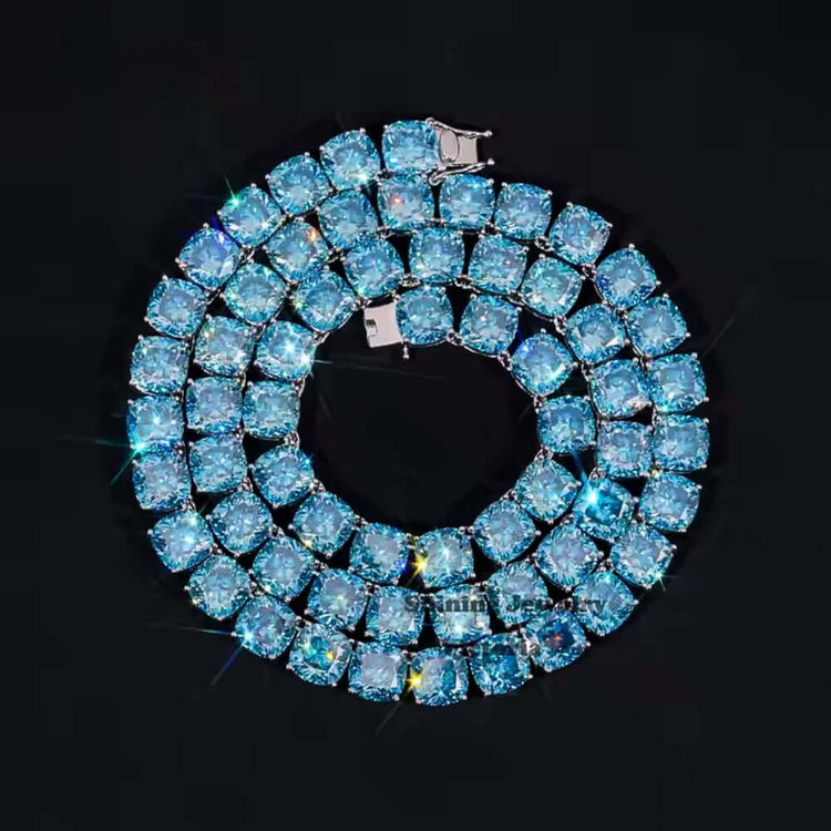 The Blue Moissanite Tennis Chain - 10mm features multiple rows of sparkling blue gemstones set in silver, creating a stunning circular necklace that stands out elegantly against a black background.