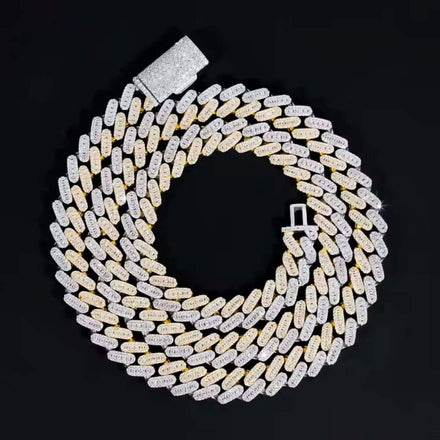 The Moissanite Cuban Link Chain - 10mm features a coiled, two-tone design with alternating gold and 925 sterling silver links. Its clasp is encrusted with small sparkling stones, all set against a black background.