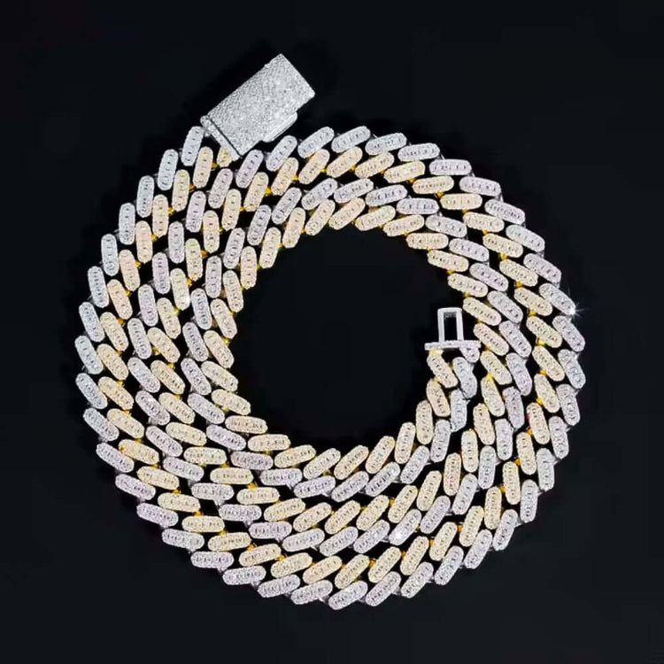 The Moissanite Cuban Link Chain - 10mm features a coiled, two-tone design with alternating gold and 925 sterling silver links. Its clasp is encrusted with small sparkling stones, all set against a black background.