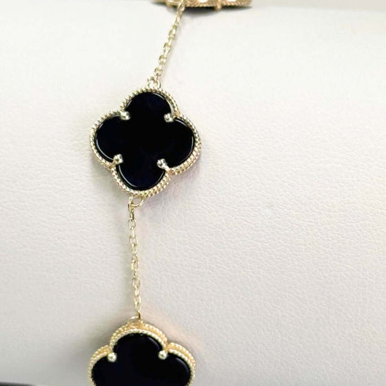 Onyx Four Leaf Clover Bracelet - 14k Yellow Gold 14k yellow gold bracelet featuring sleek black onyx four leaf clovers. A modern and elegant symbol of good luck. Shop the Onyx Clover Bracelet today!