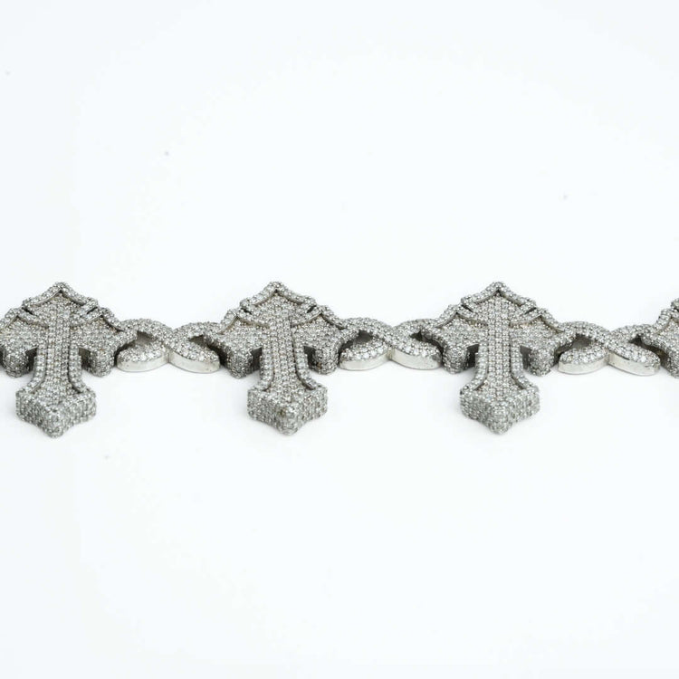 The Diamond Cross Bracelet - 10k Gold features ornate, sparkling cross motifs set in white gold and is shown on a plain white background.