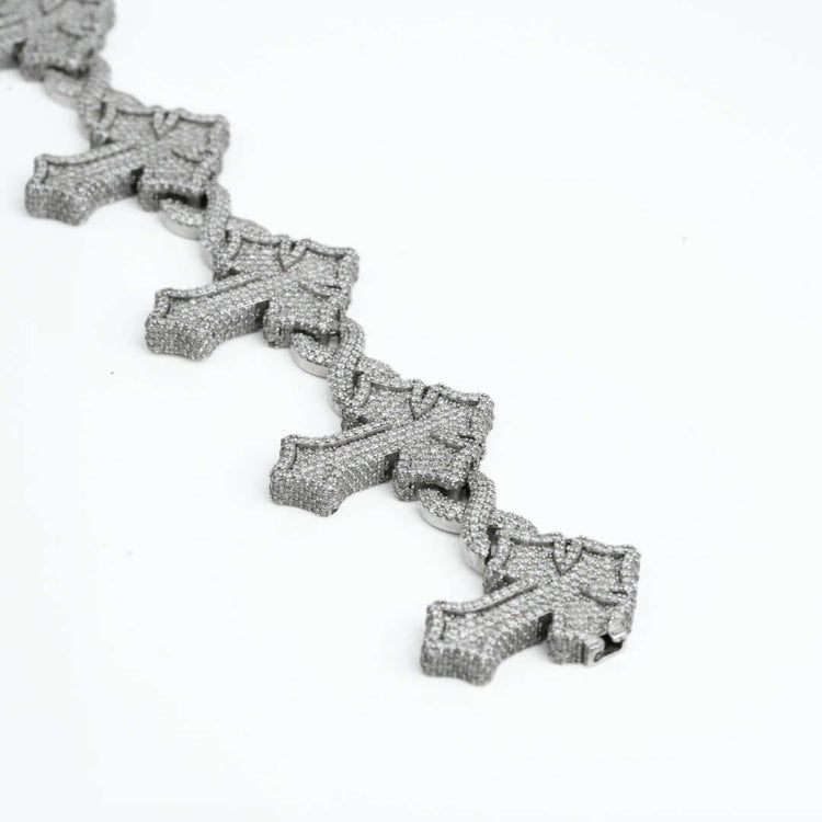 The Diamond Cross Bracelet - 10k Gold, shown on a white background, captures the elegance of diamond-adorned jewelry with its sophisticated gold cross design.