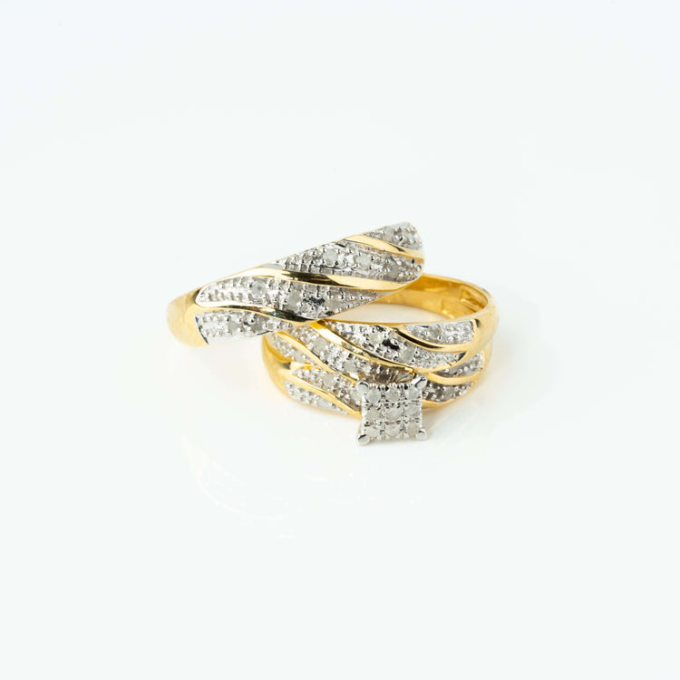 The 1/3 CTW 10k Yellow Gold Wedding Trio Set features twisted bands with small embedded diamonds and a ring highlighted by a square diamond cluster, shown against a white background.