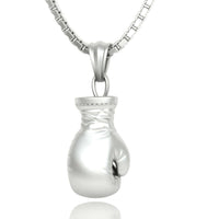 The 14K Gold Boxing Glove Pendant is a bold men's gold pendant, featuring detailed craftsmanship and a polished finish—a standout piece of boxing jewelry.