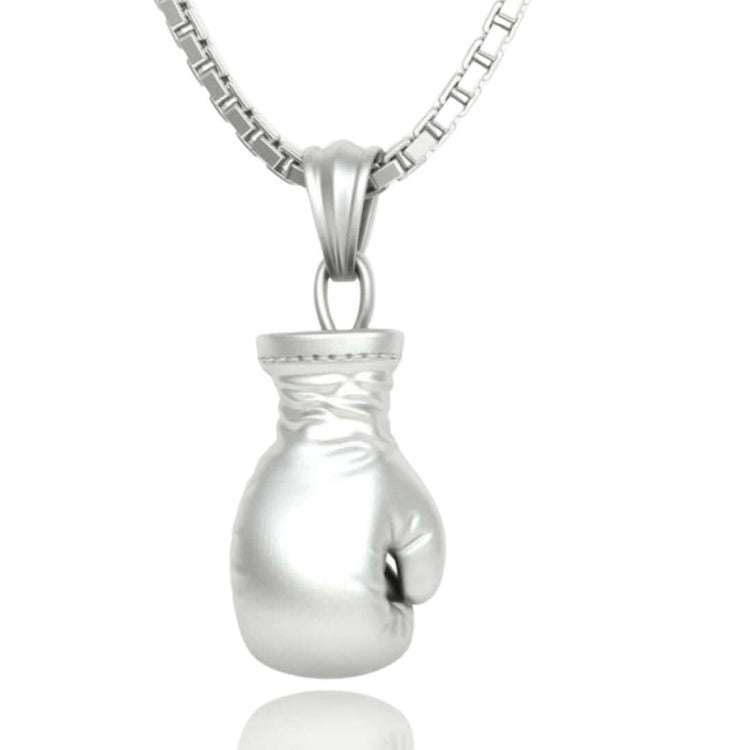 The 14K Gold Boxing Glove Pendant is a bold men's gold pendant, featuring detailed craftsmanship and a polished finish—a standout piece of boxing jewelry.
