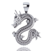 A striking 14k Gold Chinese Dragon Pendant with textured scales, S-shaped curl, detailed horns, claws, and an expressive face, shown against a white background.