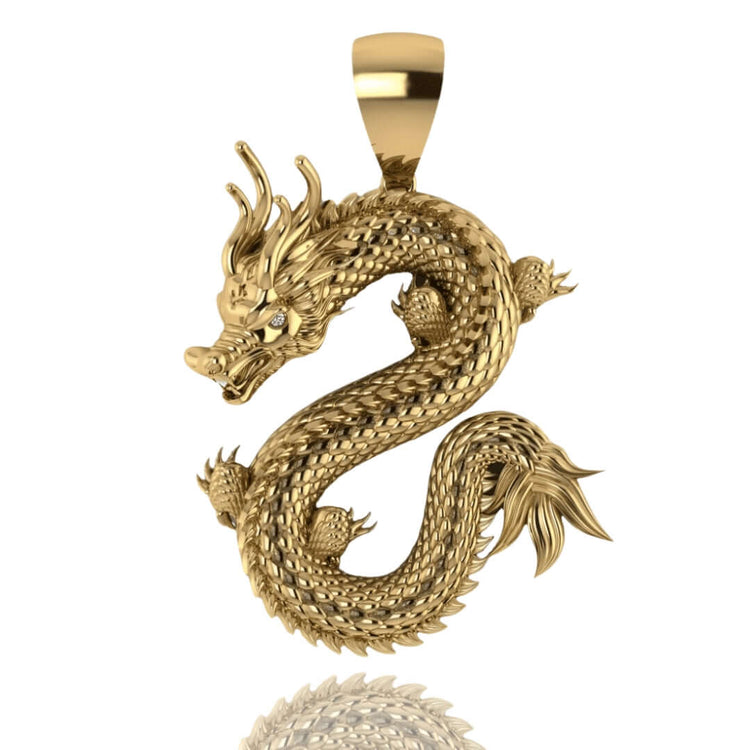 The 14k Gold Chinese Dragon Pendant showcases detailed scales and an S-curve shape, finished with a gemstone eye and set against a white background.