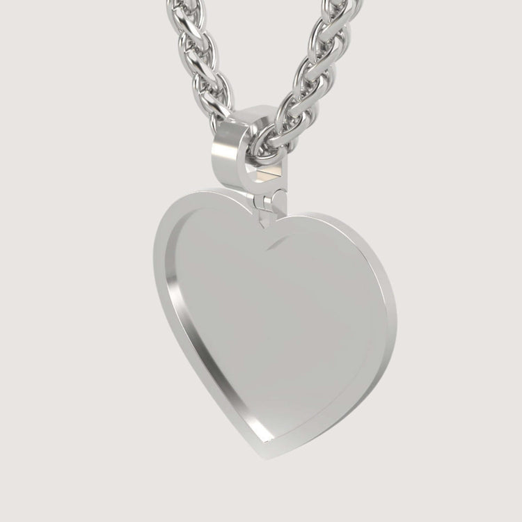 A close-up of the 14K Gold Classic Heart Picture Pendant on a thick chain, this personalized keepsake stands out against a plain light background.
