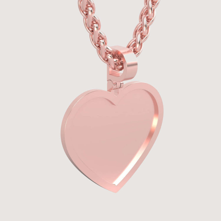 A close-up of the 14K Gold Classic Heart Picture Pendant—a shiny, polished rose gold chain necklace with a heart charm on a plain light background, perfect as a timeless, personalized keepsake.
